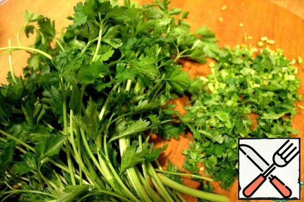 In parallel, we chop any greens, I love parsley.