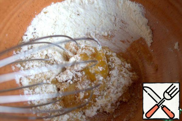 RUB the yolk with sugar and flour.