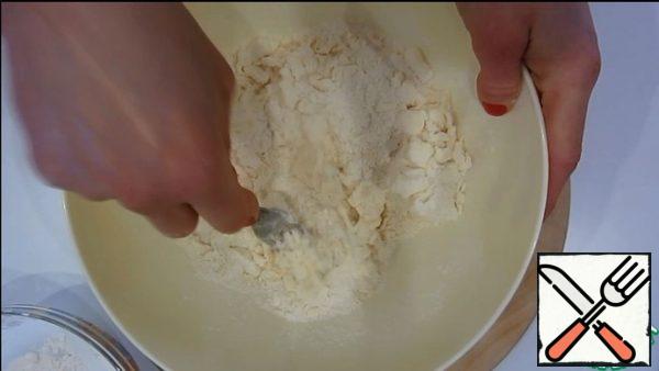 RUB the butter with sugar, baking powder, salt and half the flour.