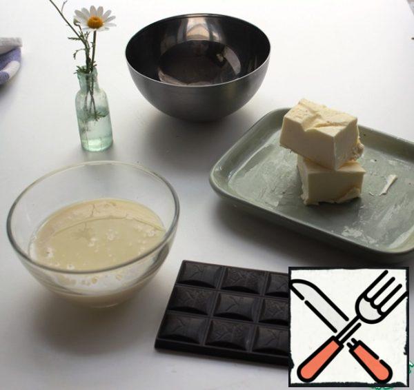 In a suitable dish, break the chocolate, add butter and condensed milk.