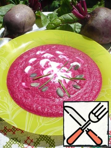 Pour the cold beetroot soup on plates, put a spoonful of yogurt in each and garnish with pumpkin seeds and serve immediately.Bon Appetit!