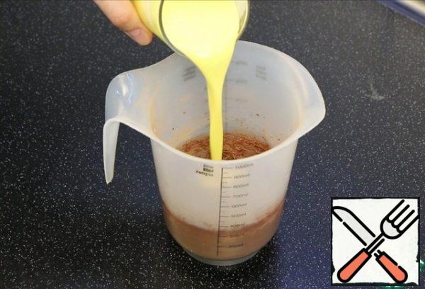 Warm cream is combined with eggs, stir and add to the butter-sugar mixture. Whisk again.