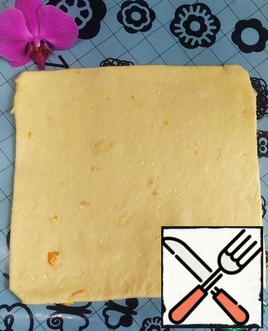 Divide our dough into 4 parts. Roll each part into a square. You can trim the edges to make an even square.