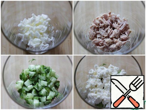 In glasses put layers: protein, sauce, tuna, cucumber with dill, cheese.