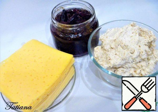 To prepare a cheese canape, you will need 8 thinly sliced slices (~10*10 cm) of semi-hard cheese. That is, two packages-sliced 125 g. (!!! when buying cheese, please note that both packages of cheese were approximately the same size).
Put the dried plum on a plate (on layers of paper towel) to get rid of excess oil. You will need ~ 45 halves of plums. From the total weight of walnuts, set aside 9-10 halves, chop the remaining nuts into small crumbs (set aside 2 tbsp.) in a bowl, put the soft curd-cream cheese, add the chopped nuts and Parmesan. Add pepper to taste and mix well.