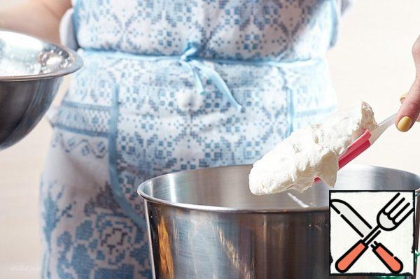Carefully mix the cream with the custard base.