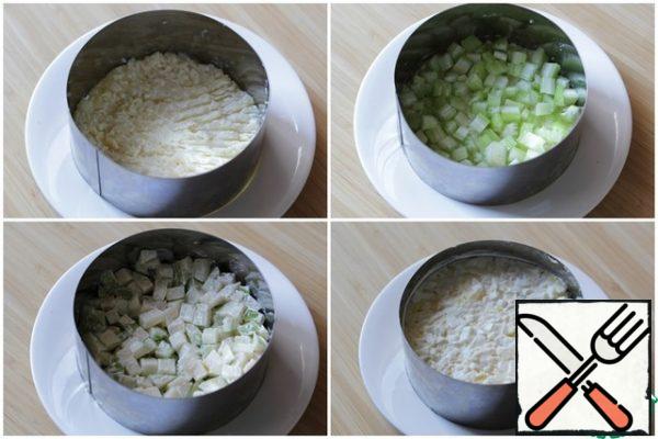 Lay out layers: potatoes, celery, apples, eggs.