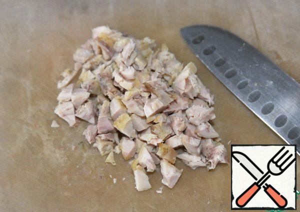 Cut the chicken fillet into small cubes. I have the meat removed from the baked hams.