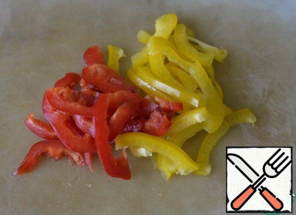 Peppers are cleaned and cut into strips as well.