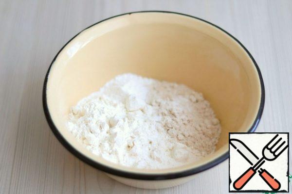In a bowl, add the dry ingredients: wheat flour (1 Cup), oat flour 1/2 Cup, baking powder (1 package). Mix the dry ingredients. I would like to draw your attention to the fact that you may need a little more flour. Flour is different. Next, you need to look at the consistency of the dough, it should be easy to work and roll out well.