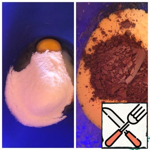 Beat the eggs with the sugar and vanilla for 2 minutes on a high speed mixer. Add the butter and cocoa and beat for a minute.