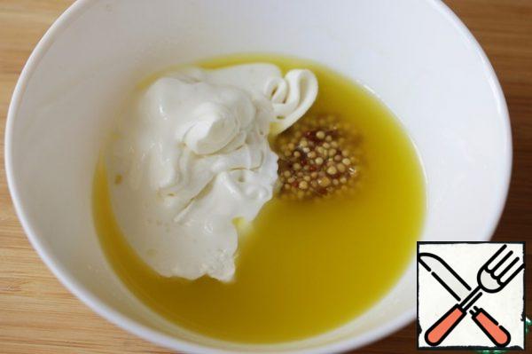 Beat the olive oil and lemon juice to a smooth emulsion, add the mustard, yogurt and season to taste with salt.