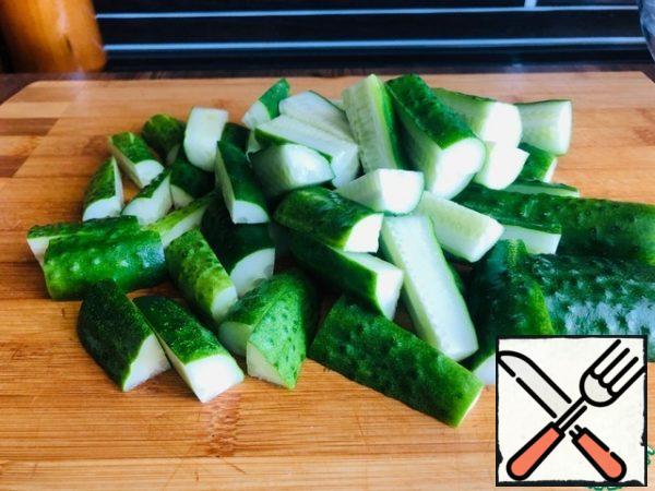 Cucumbers are washed and cut into cubes.