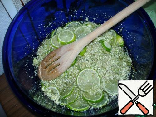 Put the inflorescences in a glass bowl. Slice the lemon and add the chilled water and sugar. Cover and leave for 1-3 days, stirring occasionally, or leave in the refrigerator for 3-5 days, stirring every day.