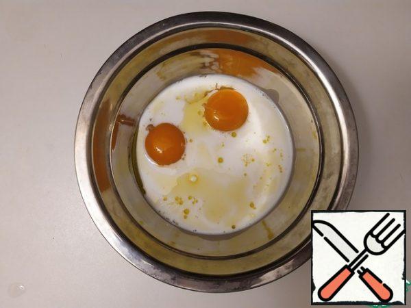 Add olive oil and milk to the yolks.