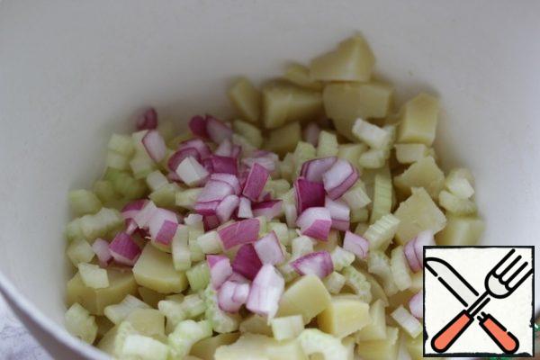 Then finely chopped salad onions.