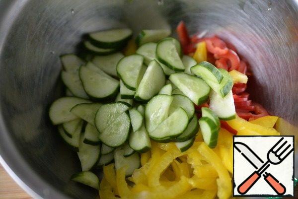Add the cucumbers cut in half rings.