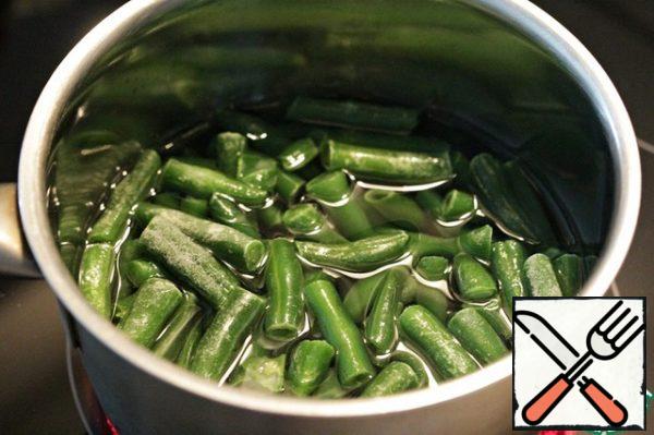 Boil the string beans in salted water to the degree of readiness that you like, then cool.
