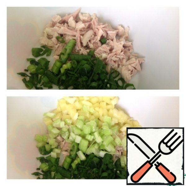 Cut the boiled chicken breast into small cubes and chop the onion. Add bell pepper and celery finely diced.