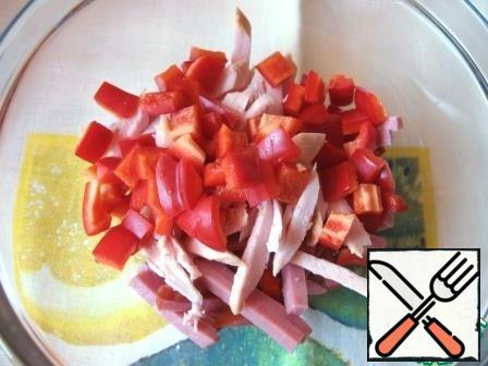 Cut bell peppers into small cubes and add to the meat.