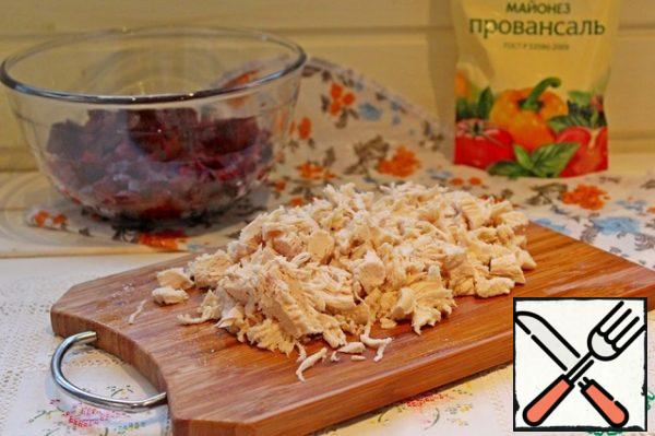 Boiled chicken fillet is also cut into small cubes.