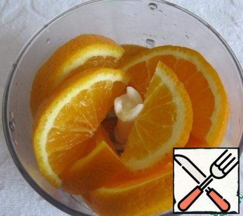 Chop half an orange in a blender.