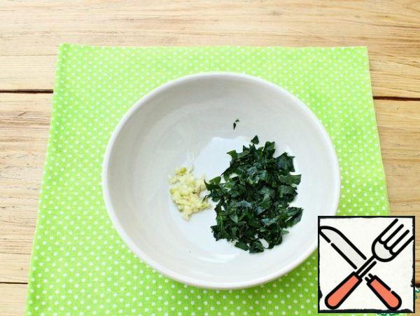Peeled garlic will pass through the press. Parsley leaves (stems are not used) finely chop and combine with garlic.