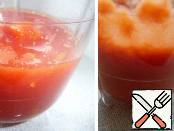 Lightly beat the tomatoes in their own juice.