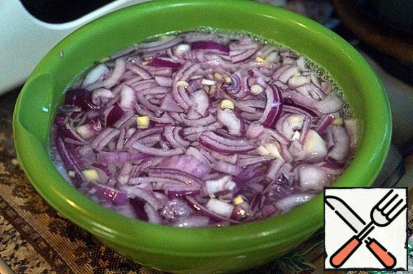 Onions cut into thin segments, blanch – to do this, pour boiling water and hold it for a couple of minutes.