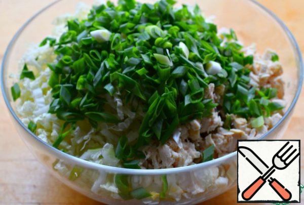 Put all the ingredients in a large salad bowl, add the chopped green onions, and season with the sauce (sour cream or mayonnaise).