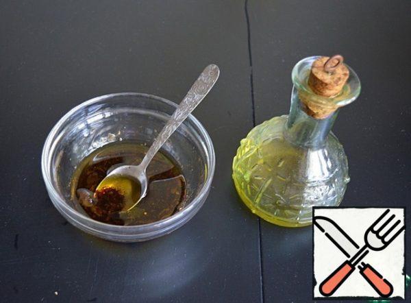 Prepare a salad dressing from olive oil, balsamic vinegar, salt, freshly ground pepper and crushed garlic clove.