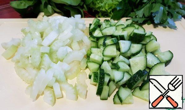 Cut cucumbers and celery.