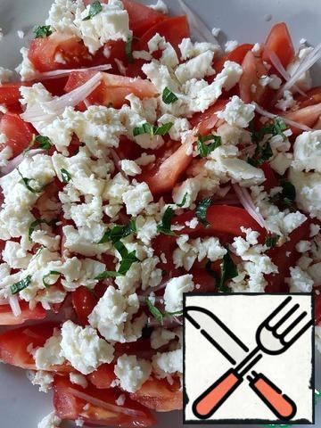 Put the cheese on the tomatoes, diced or mashed with a fork into different sized pieces. Sprinkle with finely chopped mint (I used 2 small leaves).