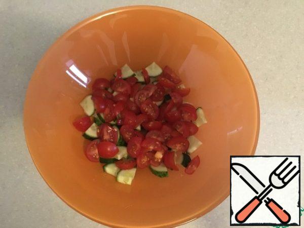 Cut the cherry tomatoes.