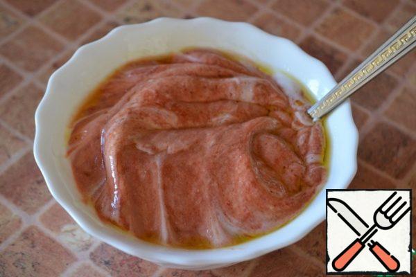 Mix the tomato paste, natural yoghurt and olive oil in a separate bowl.