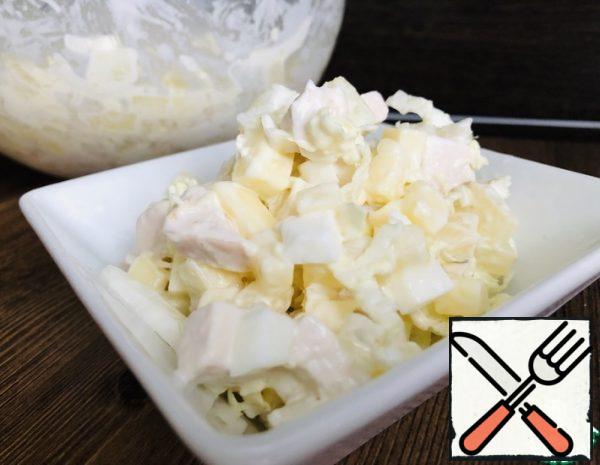 1. Chicken breast boil in salted water.
2. Eggs boiled in steep, cool, clean.
3. Chicken breast, egg, pineapple, cheese cut into small cubes.
4. Cabbage thoroughly wash and chop. Garlic passed through the press.
5. In bowl mix: sliced chicken breast, cheese, egg, pineapple, cabbage, garlic, add mayonnaise, salt to taste and stir.