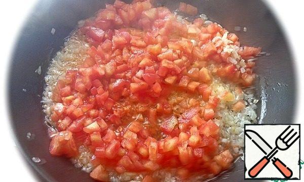 Peel the tomatoes and add them to the onion.