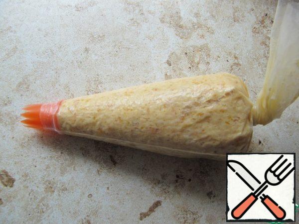 Fill a pastry bag or tight bag by cutting off the edge.