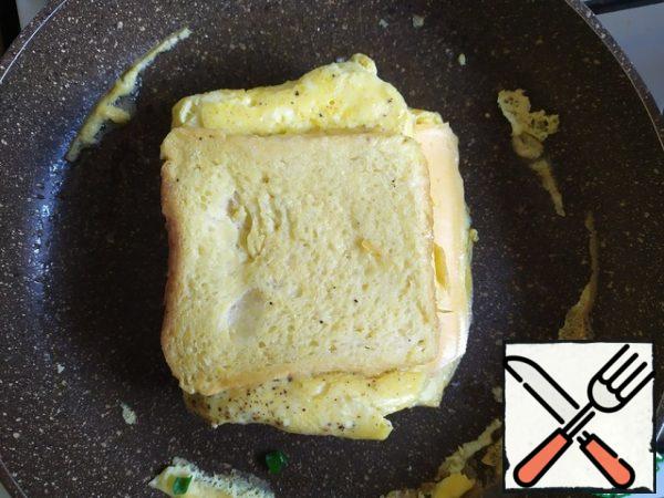 And fold our sandwich. Then fry a little on both sides.