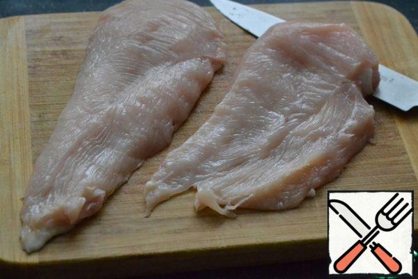 Cut the chicken breast in half.