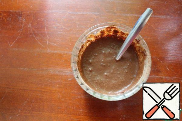 Mix the cocoa powder with 2-3 tablespoons of water...