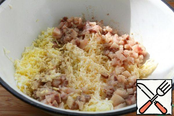 Eggs, melted cheese grate on a fine grater.
Fold into a bowl.
Cut the herring very small, add to the cheese and eggs.