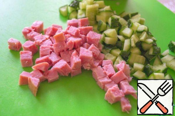 Cucumber and ham cut into cubes.