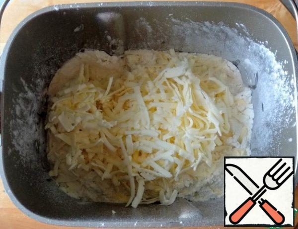 Grate the butter on a coarse grater.