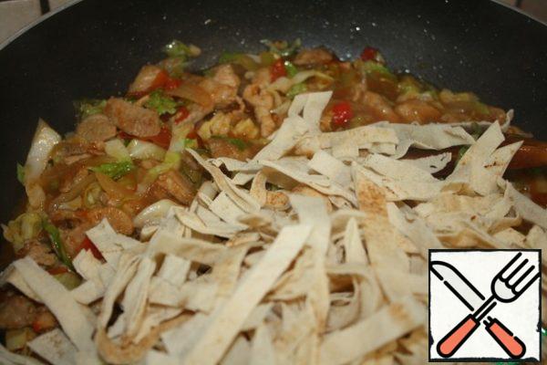 At the end, add the sliced tortilla and cook for about 5 minutes, stirring well.