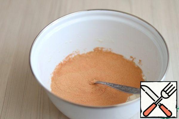 In a bowl, add 200 ml. warm milk, add the total amount of sugar (1/2 Cup), add 3 tablespoons of flour, add 10 g. granulated yeast. Beat the mixture with a whisk. Cover the container with plastic wrap or a towel and put it in a warm place to dissolve the yeast.