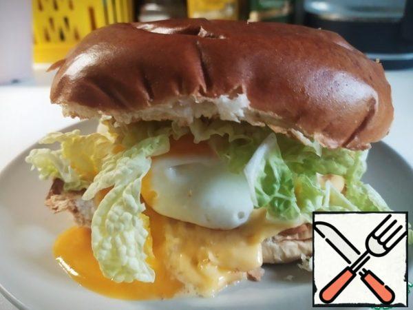 On a salad bun and ... press it so that the yolk spreads and awakens an immediate desire to eat this sandwich.Bon appetit.