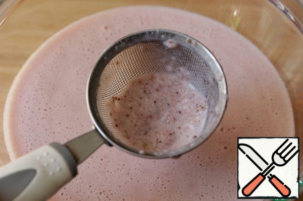Strain everything through a sieve, this will remove the strawberry seeds and lumps of undissolved gelatin, if they remain.