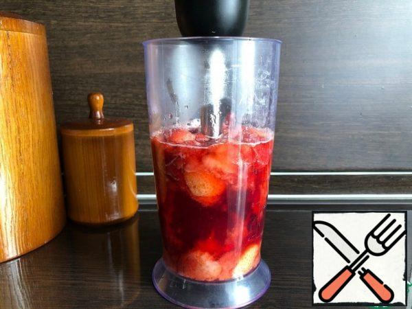 - Transfer the finished strawberries to the bowl of a blender, chop them.