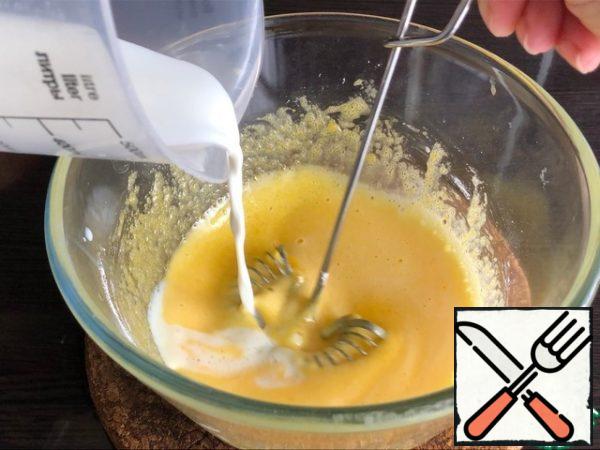 - Heat the milk to 60 g. and add a thin stream to the yolk mass.